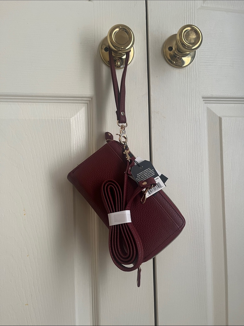 Julia Buxton Burgundy Pebble Ultimate Organizer RFID Blocking Wallet on a string